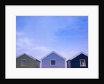 Beach huts in a row against sky by Assaf Frank